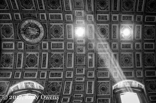A so-called "god beam" illuminates the vaulted ceiling of St. Peter's Basilica, in the Vatican City, in Rome.