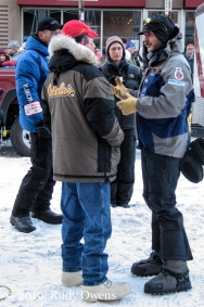 Norwegian musher and two-time Iditarod champion Robert Sørlie speaks with fellow mushers.